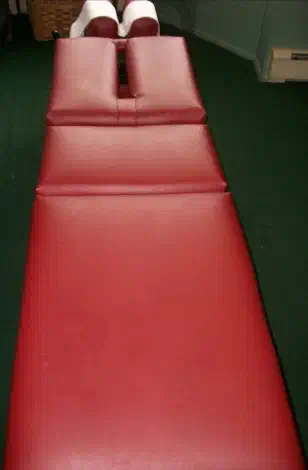 Chiropractic treatment table prepared for professional spinal adjustment care